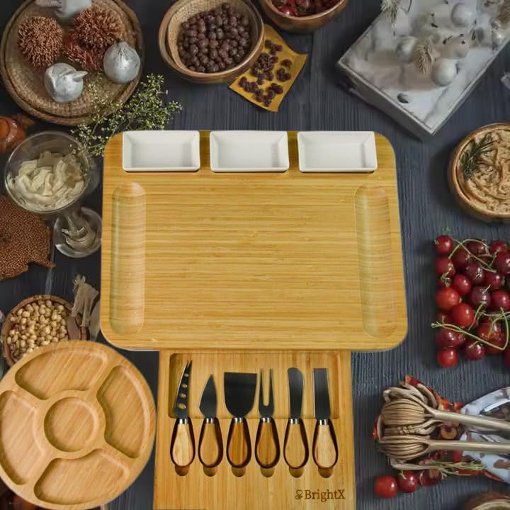 A cheese board made of bamboo, with knives and forks inside.